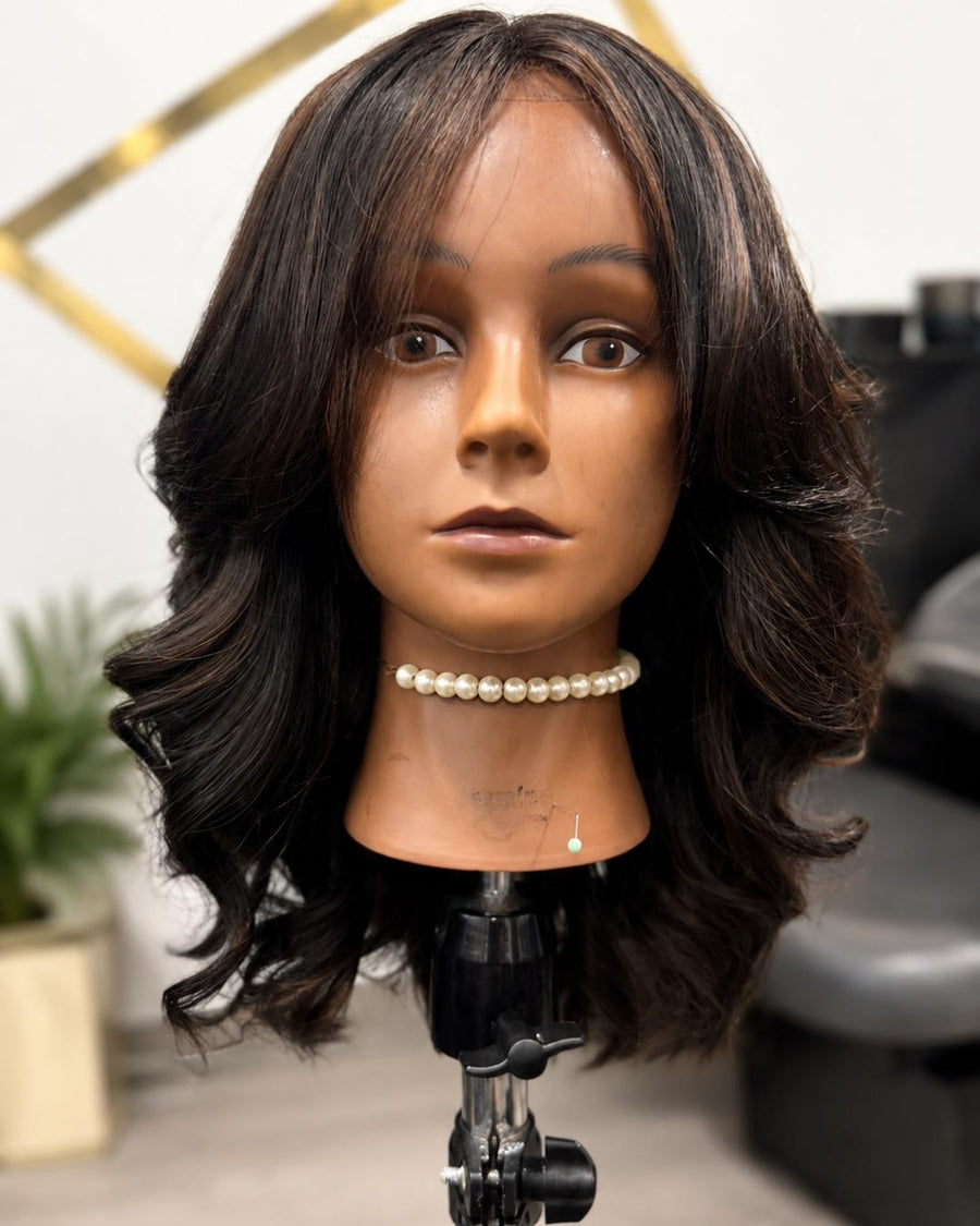 Licensed hairstylist wearing a wig made with Private Label Extensions human hair