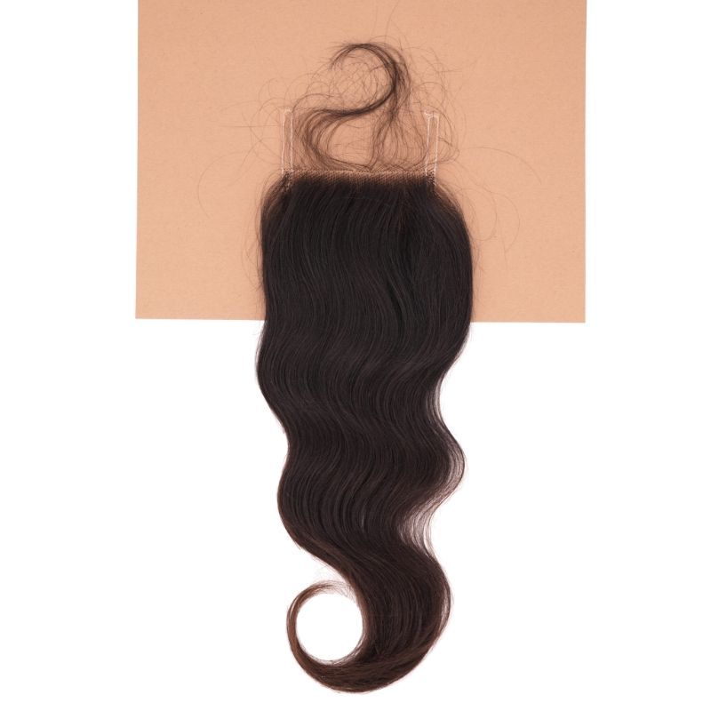Raw Indian Wavy Closure on brown background